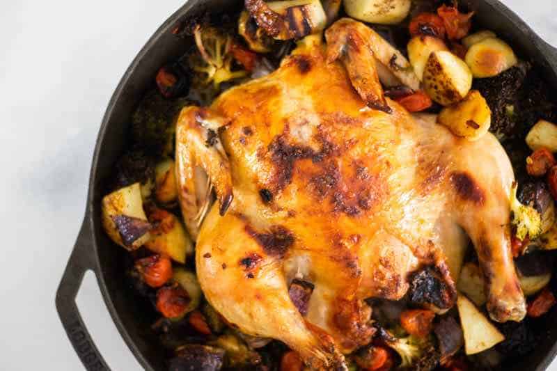 Tuscan roasted chicken in a cast iron skillet.