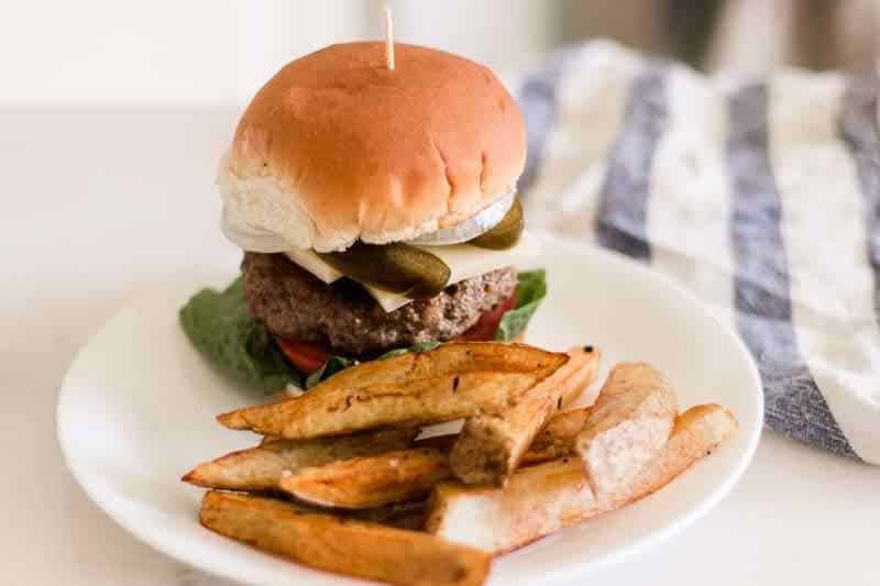 Skillet seared burger with hand cut fries.