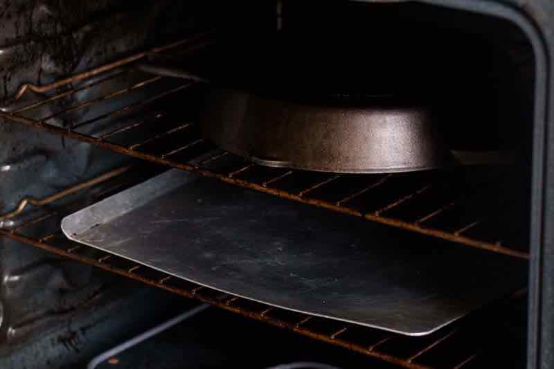 Seasoning a cast iron skillet in the oven.