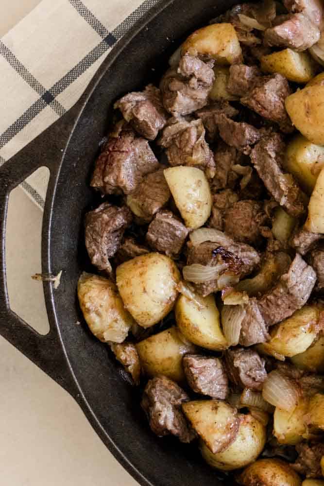 Pan-seared sirloin steak and diced potatoes.