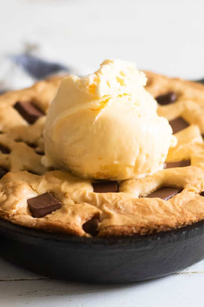 Cast iron cookie with a heaping scoop of ice cream.