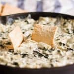 Spinach artichoke dip with pita chips.