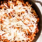 Roasted butternut squash and bacon skillet topped with white cheddar cheese.