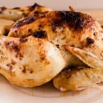 Dutch oven roast chicken on a serving platter.