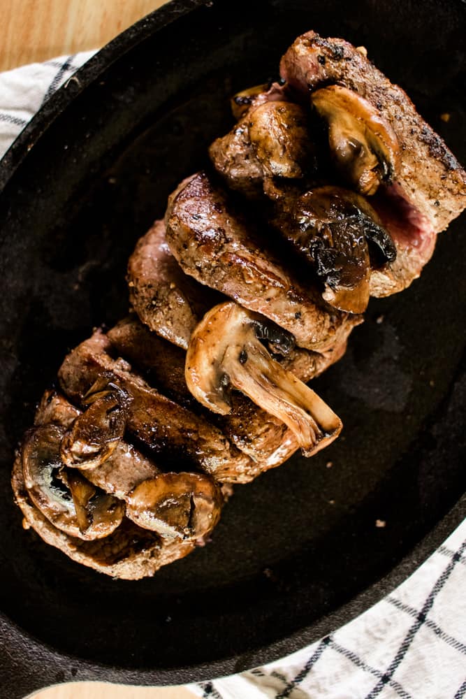 Sizzle platter with steak smothered with mushrooms.