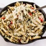 Scooping out a heap of chicken pesto pasta.