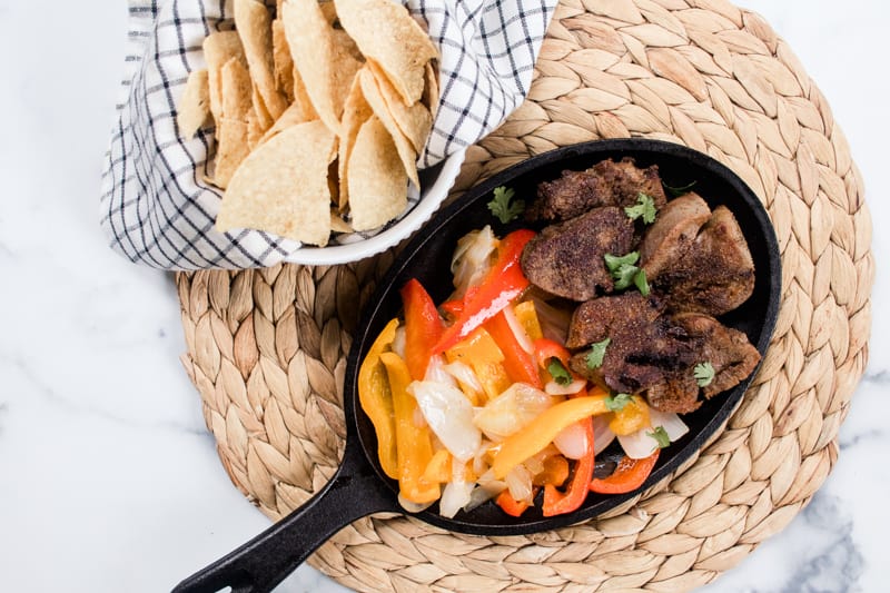 Pan fried beef tongue fajita style with chips.