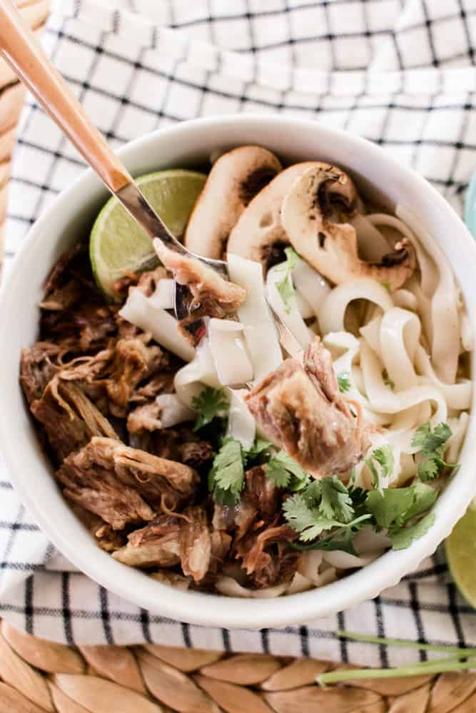 Taking a bite of of a Vietnamese noodle soup. 