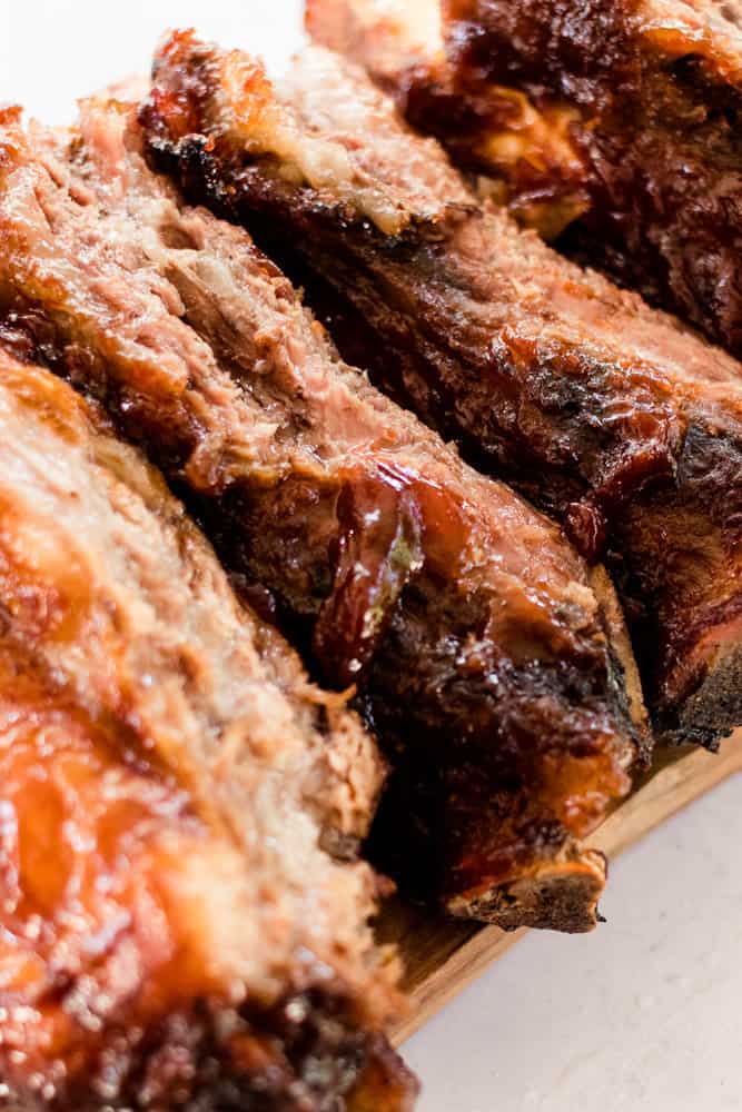 Close up of juicy tender, ribs covered in a bbq sauce glaze.