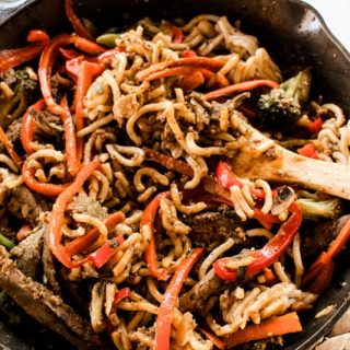 Beef liver stir fry in a cast iron skillet.