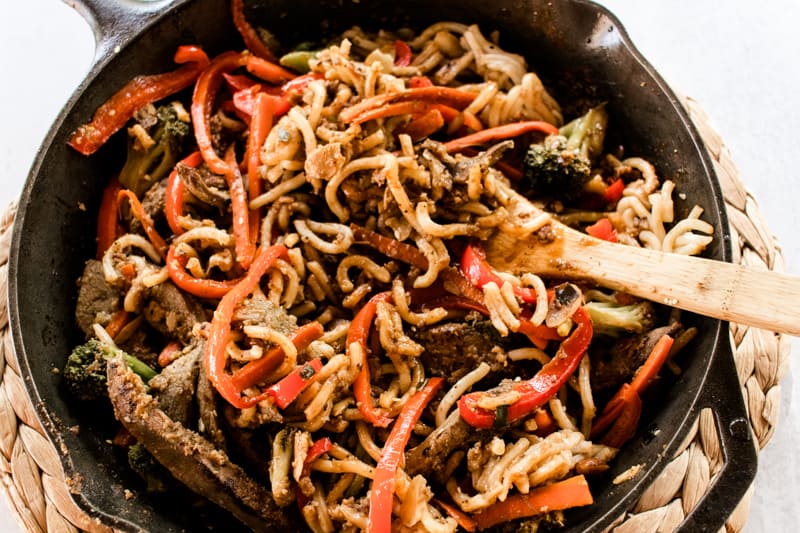 Beef liver stir fry in a cast iron skillet.