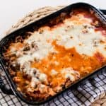 Zucchini lasagna with a thick layer of mozzarella cheese melted into the top.