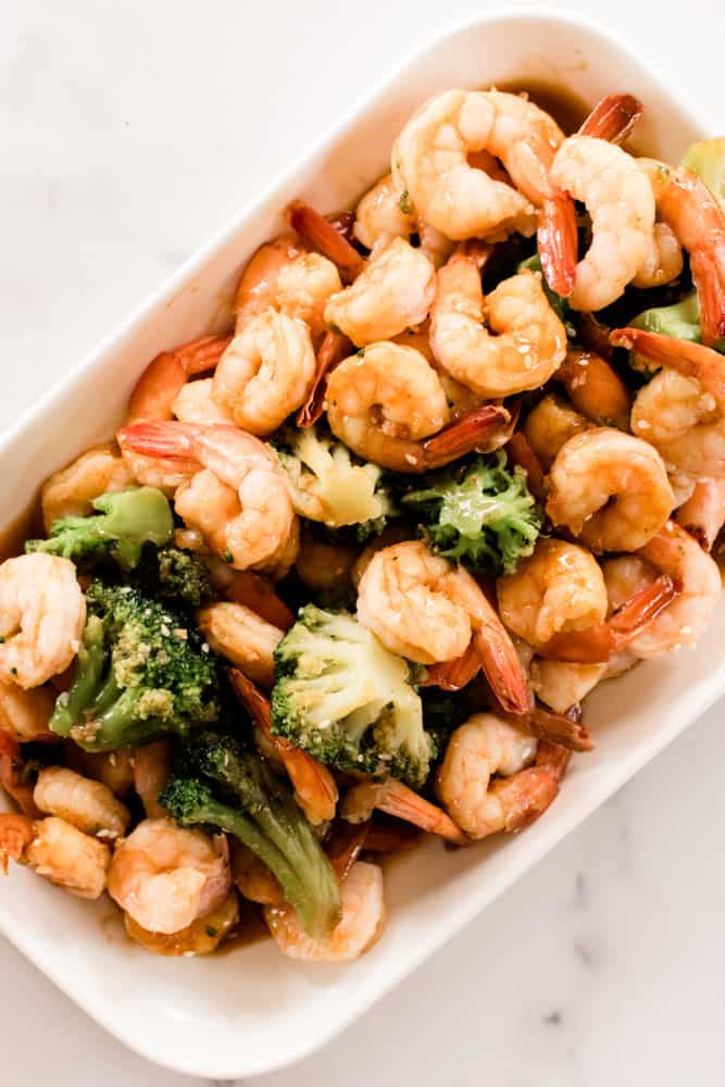 Hearty shrimp platter with broccoli.