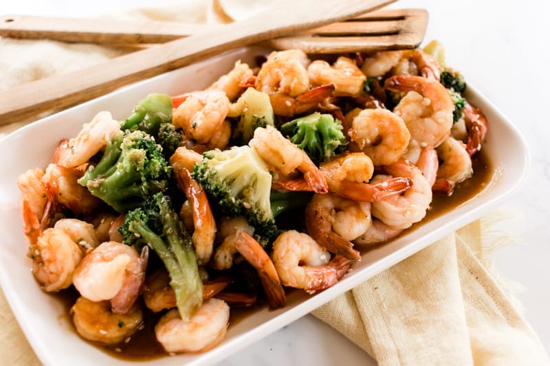 Hearty shrimp platter with broccoli.