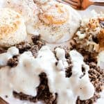 Venison breakfast sausage covered in gravy with homemade biscuits eggs and hashbrowns.