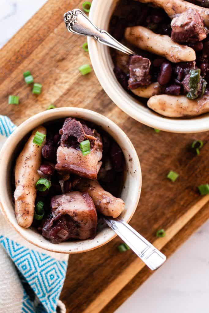 Stew peas, spinners and pigs tails in large soup bowls