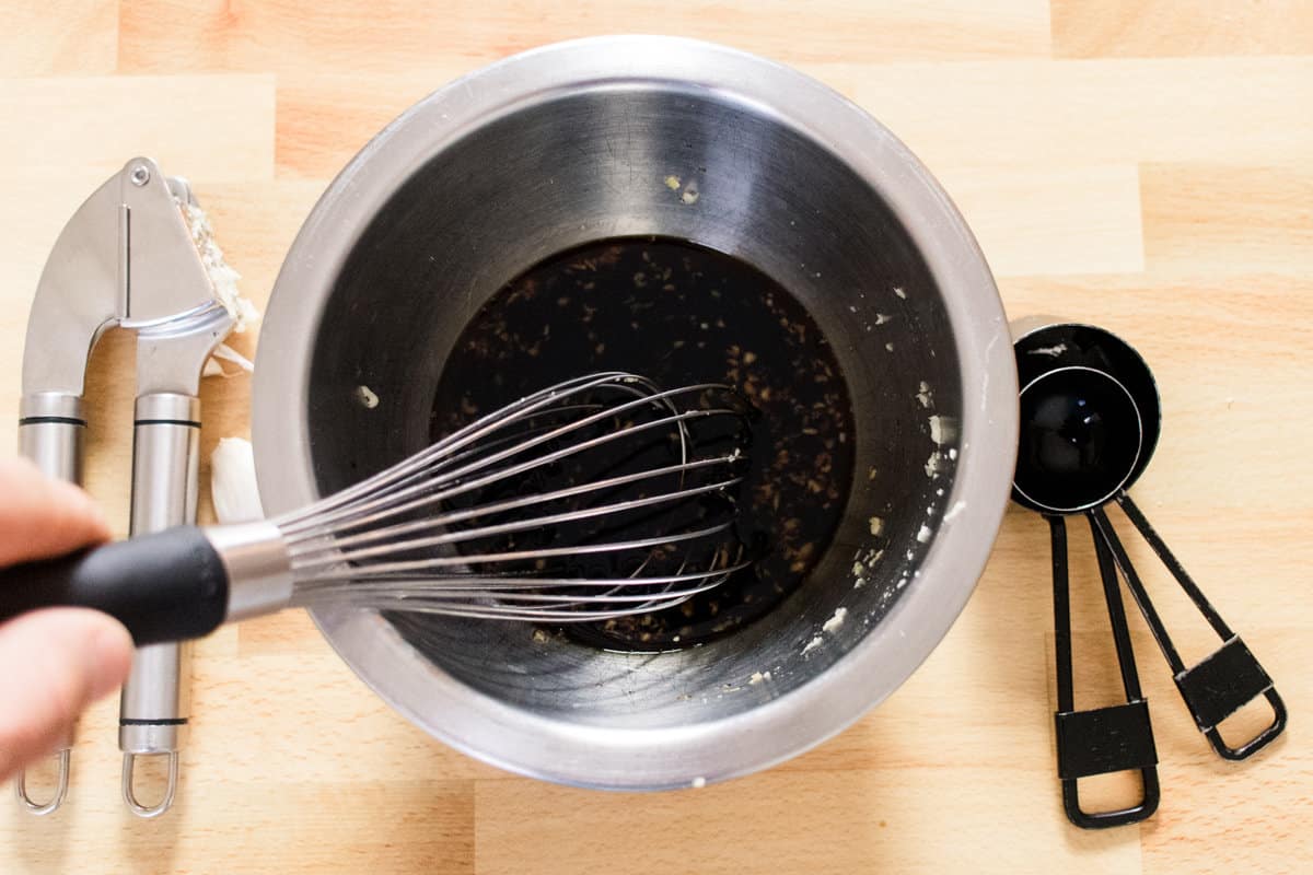 Combining the marinade for the steaks. 