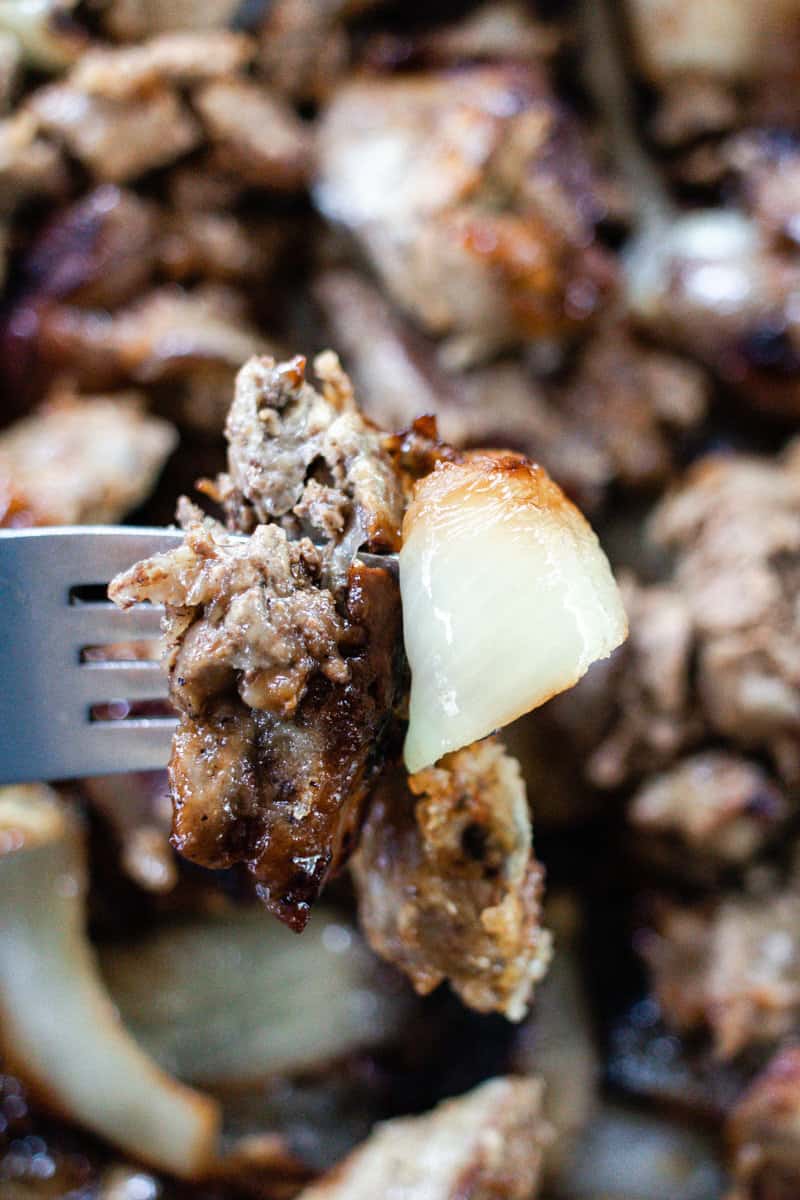 A chicken liver on the end of a fork.