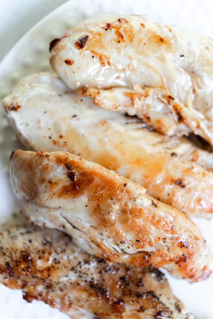 Chicken tenders that have been boiled and then pan seared.