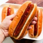 Perfectly cooked hot dog in a warm bun.