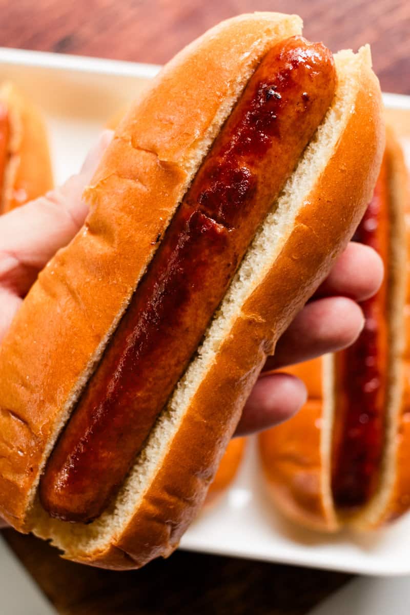 A perfectly cooked hot dog in a warm bun.