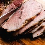 Cutting a rump roast with a sharp knife.
