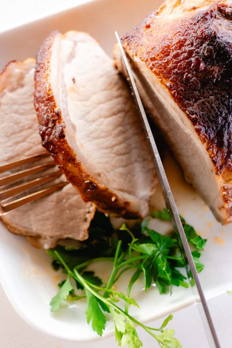 Cutting up a pork loin roast for meal planning lunches.