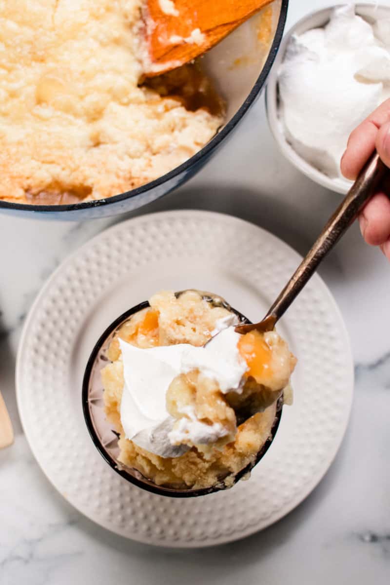 A dish of dutch oven baked dump cake on a glass plate. 