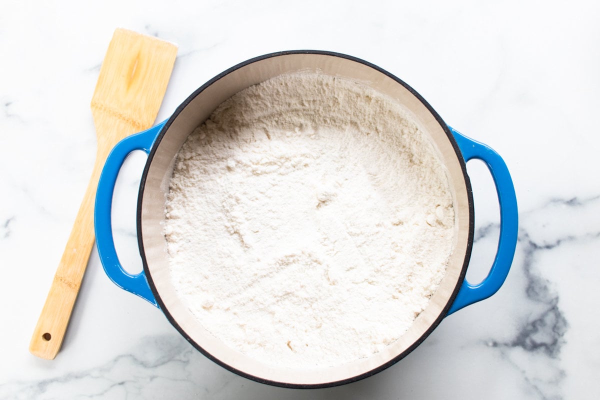 Cake mix sprinkled evenly over top of the filling of the dump cake.