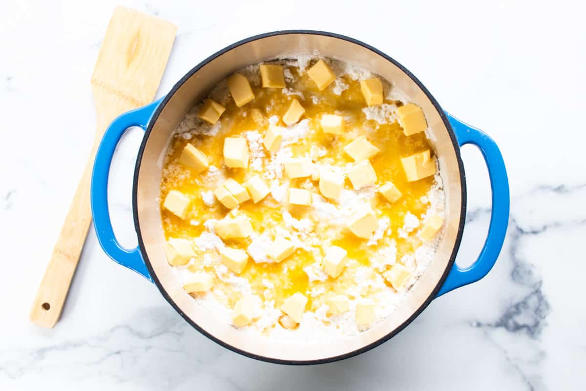 Diced up sticks of butter arranged over top of the cake.