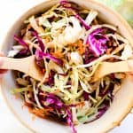 Tossing together a vinegar coleslaw recipe for a pulled pork dinner.