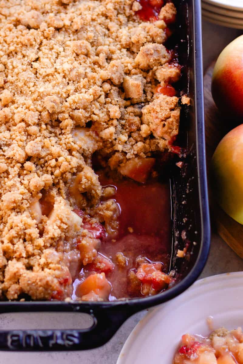 Apple strawberry crumble in a staub baking dish.