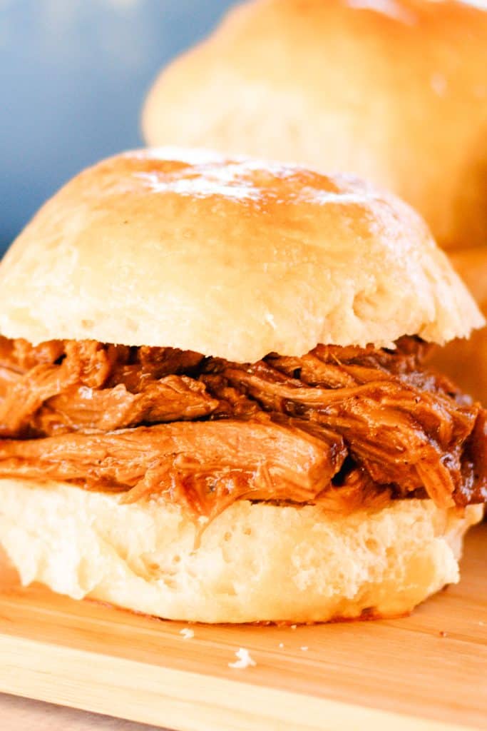 Juicy pulled venison sandwich with homemade barbecue sauce sandwiched between a delicious bun.