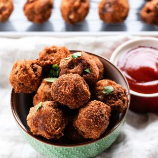 Deep fried meatballs being served as a side dish for game night.