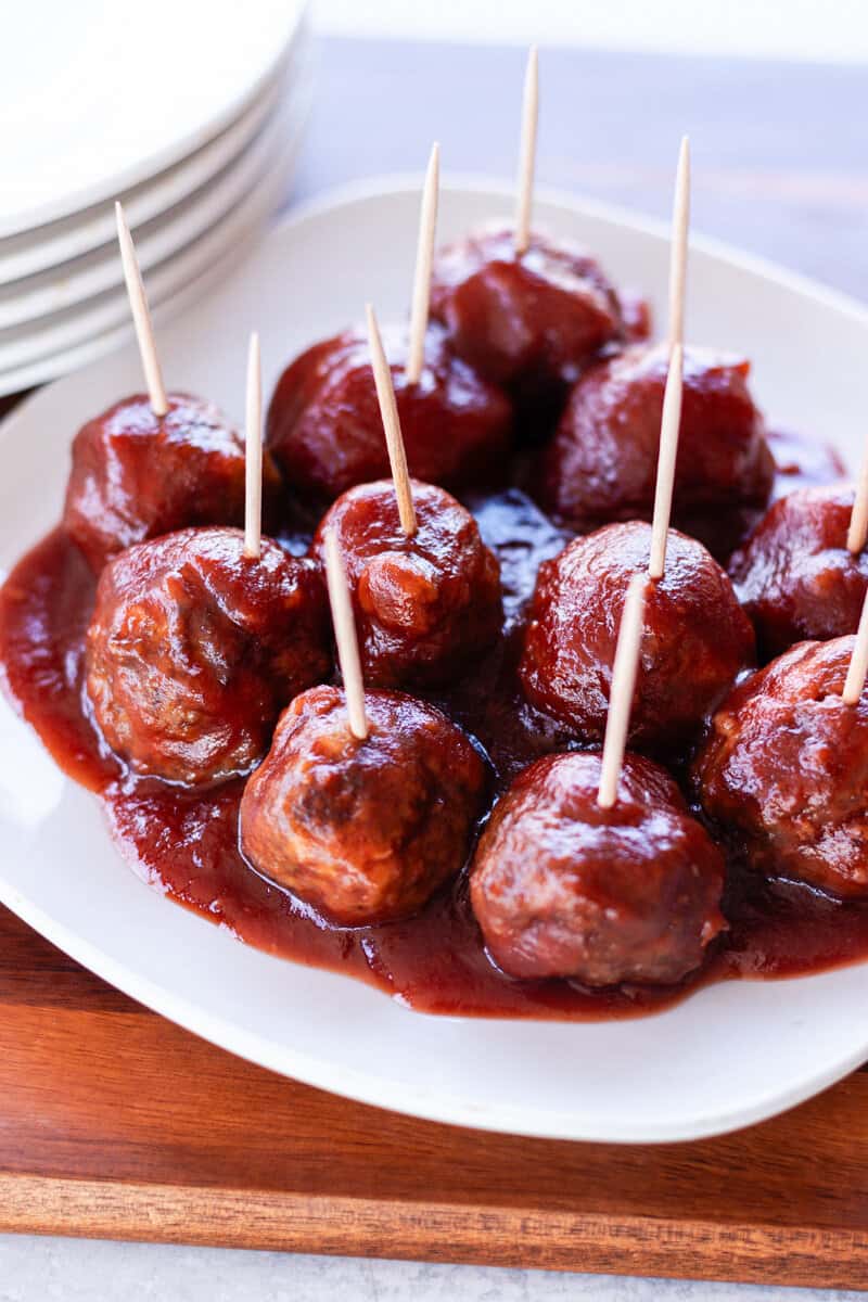 Elk meatballs in a cranberry sauce with toothpicks.