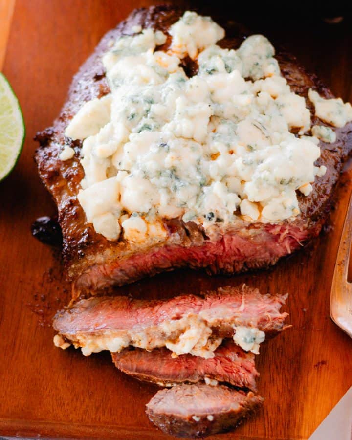 Blue cheese crumble steak recipe after it has rested and sliced into a corner of it.