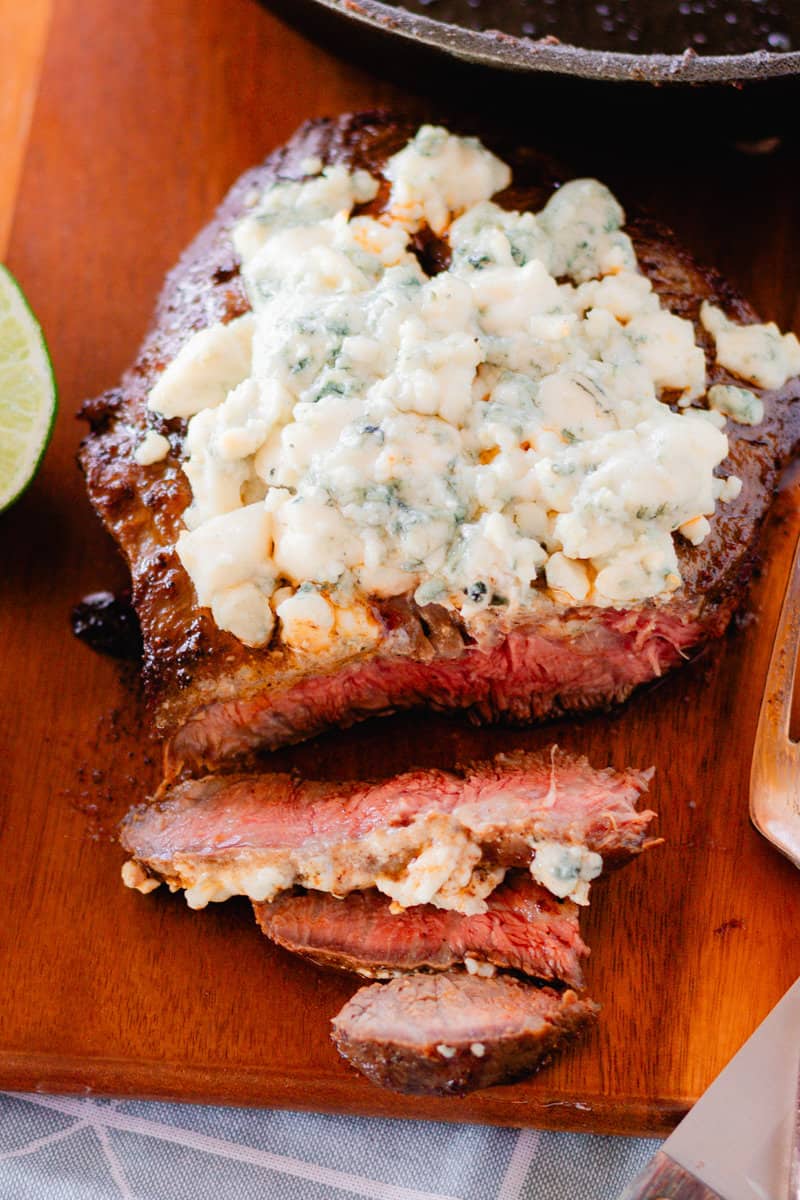 Blue cheese crumble steak recipe after it has rested and sliced into a corner of it.