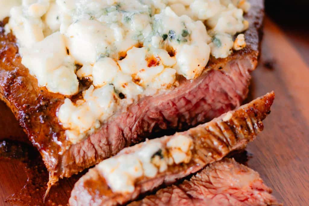 Flat iron steak with melted blue cheese crumbles.