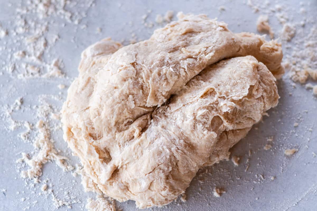 Kneading the dough on the counter. 