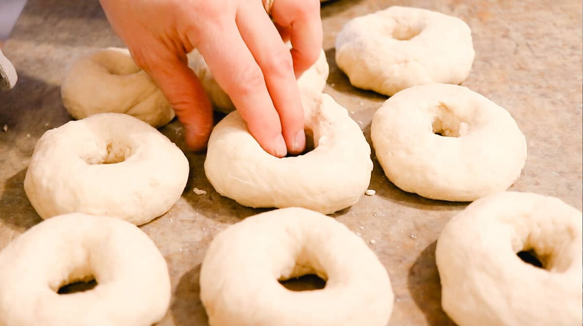 Shaping the dough into bagels.