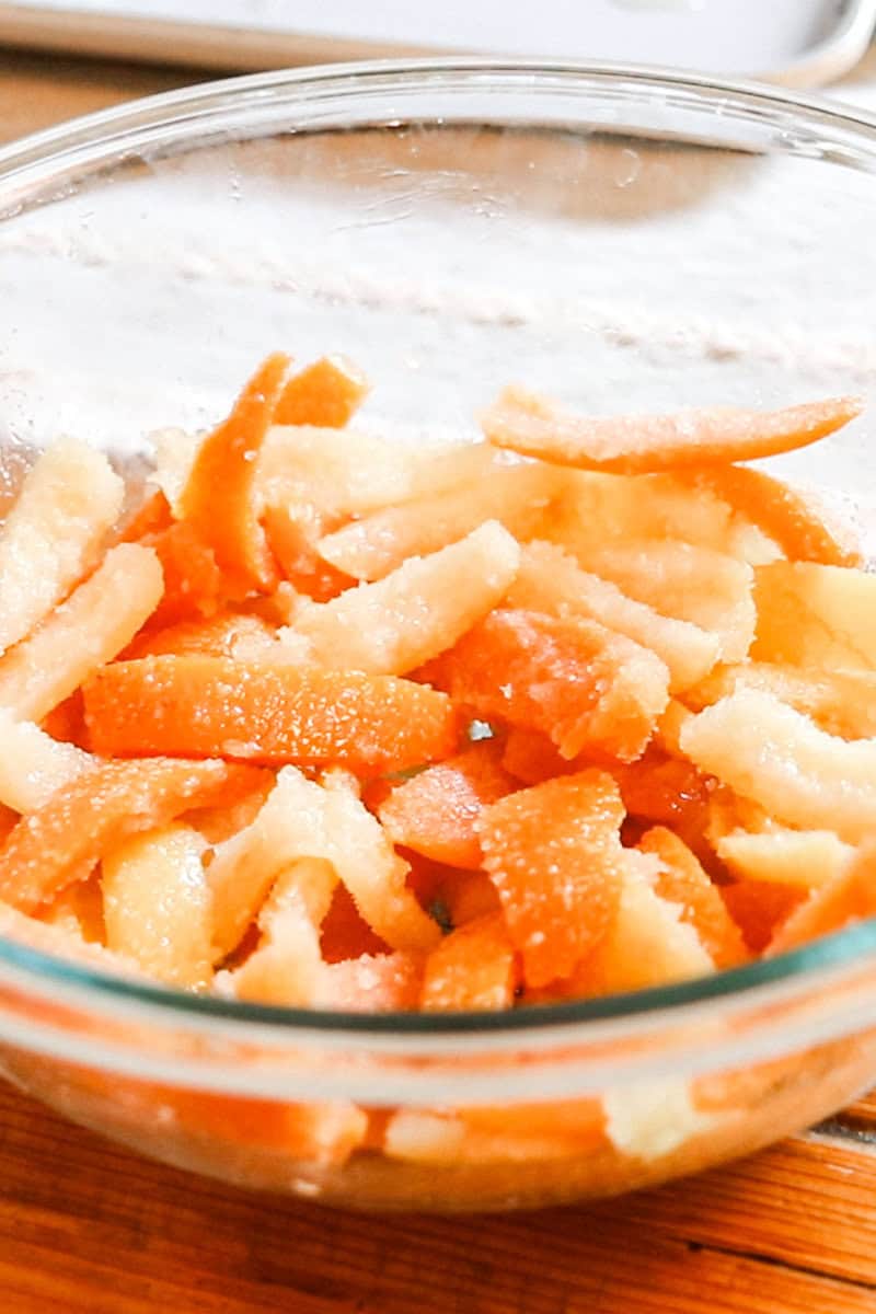 Sour candied fruit peels in a small glass bowl.