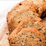 Banana bread with chocolate chips and walnuts in a cast iron lodge loaf pan.