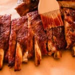 Dutch oven pork ribs with bbq dipping sauce.