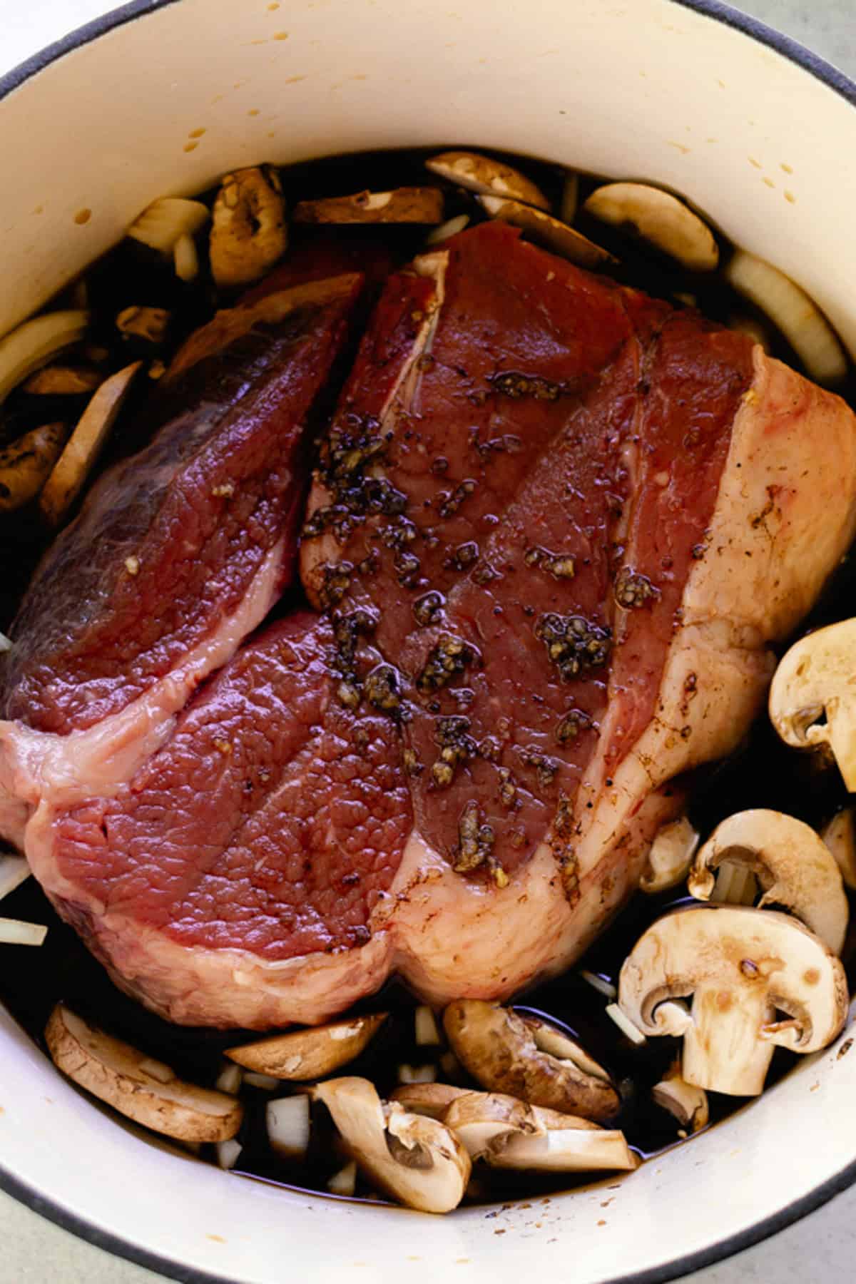 All the ingredients for the roast in a large dutch oven. 