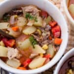 Bowl of pork neck bone soup on a wooden table.