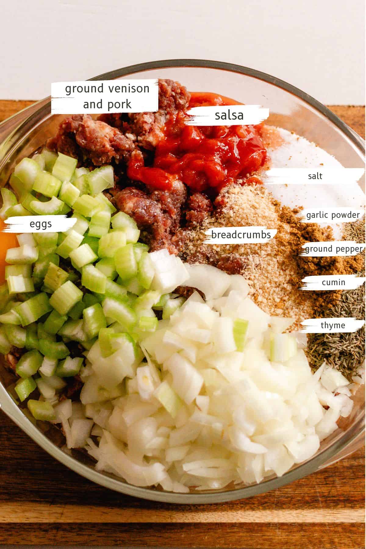 Ingredients for the venison meatloaf in a large mixing bowl.