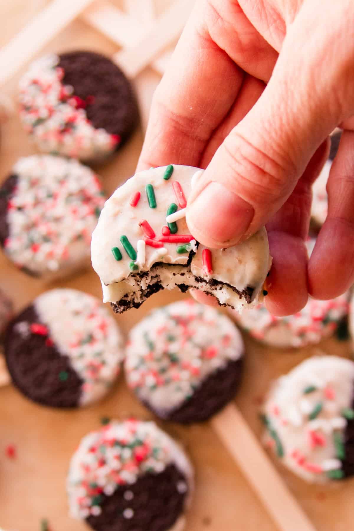 Bite taken out of a christmas oreo.