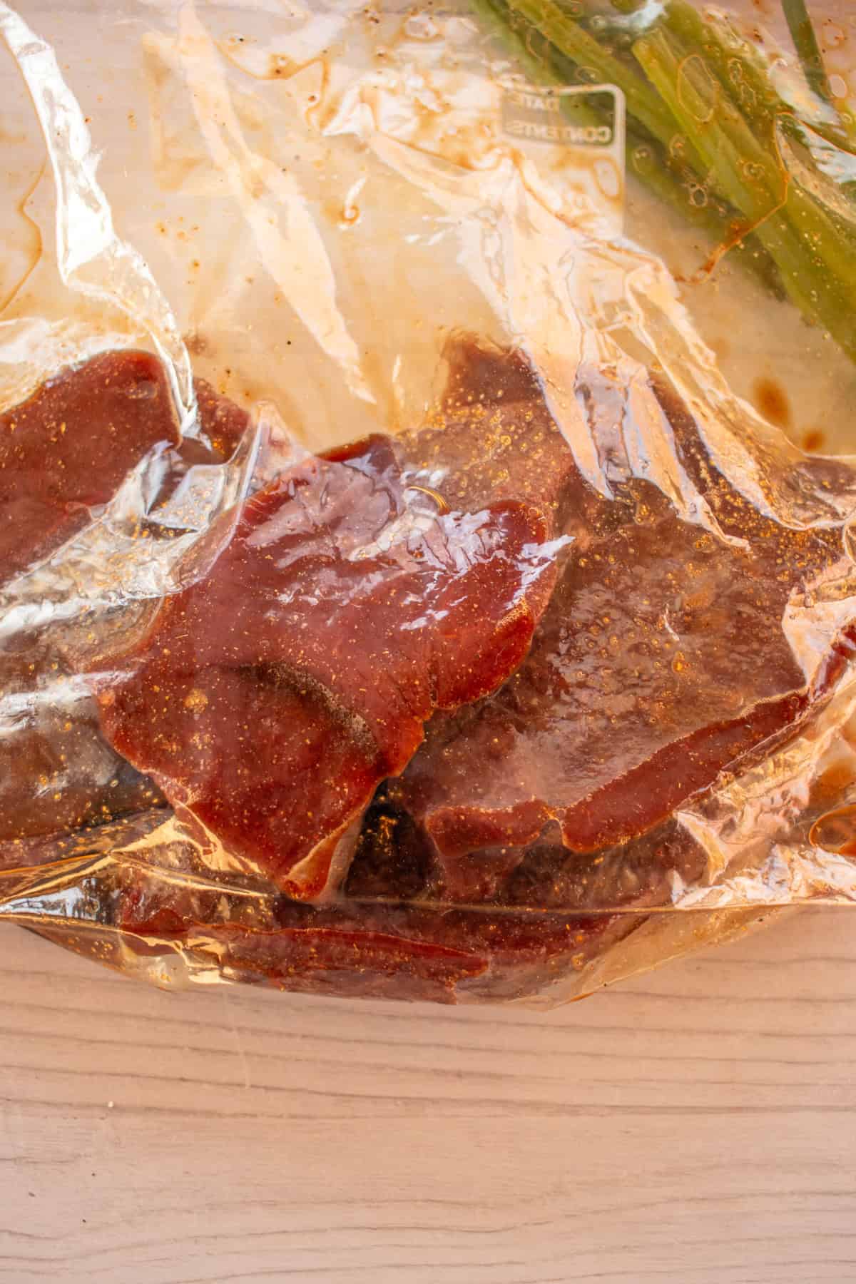 Venison steaks in a ziplock bag marinating. 