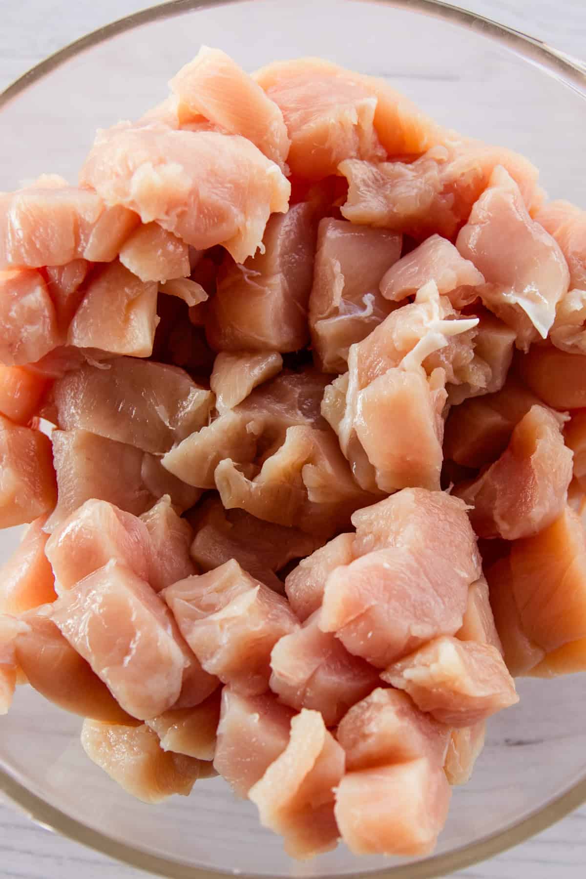 Raw chicken tenders cut into bite size pieces. 