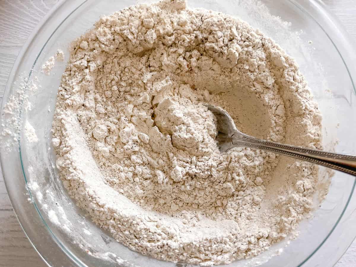 Dry breading mixture in a bowl ready to be used for cast iron fried chicken.